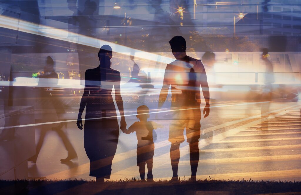 Family,Walking,Together,Through,Modern,City,Life,,Parents,And,Child